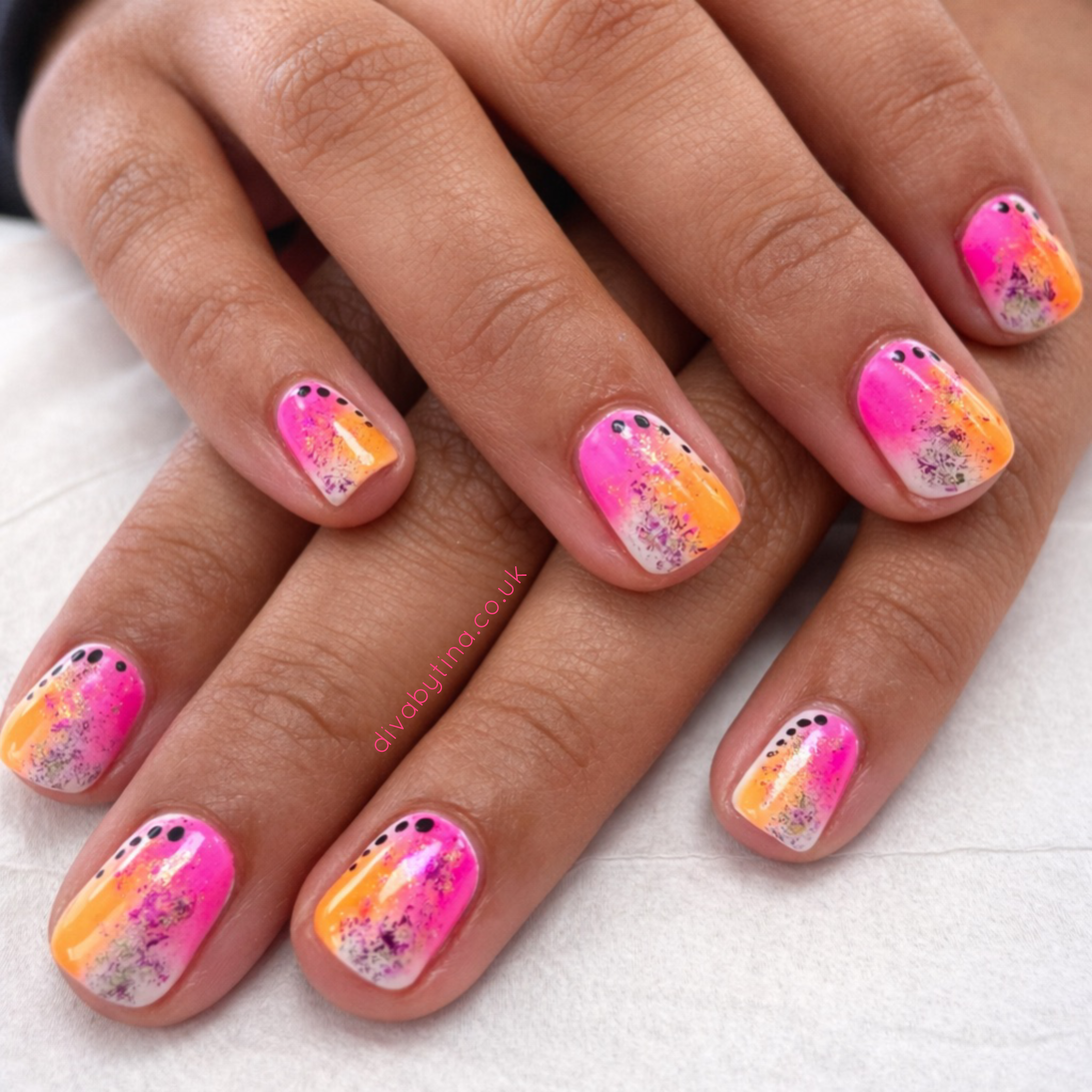 alt="Colourful pink and orange gel nail art with abstract design on short nails at a professional nail salon in Liverpool"
